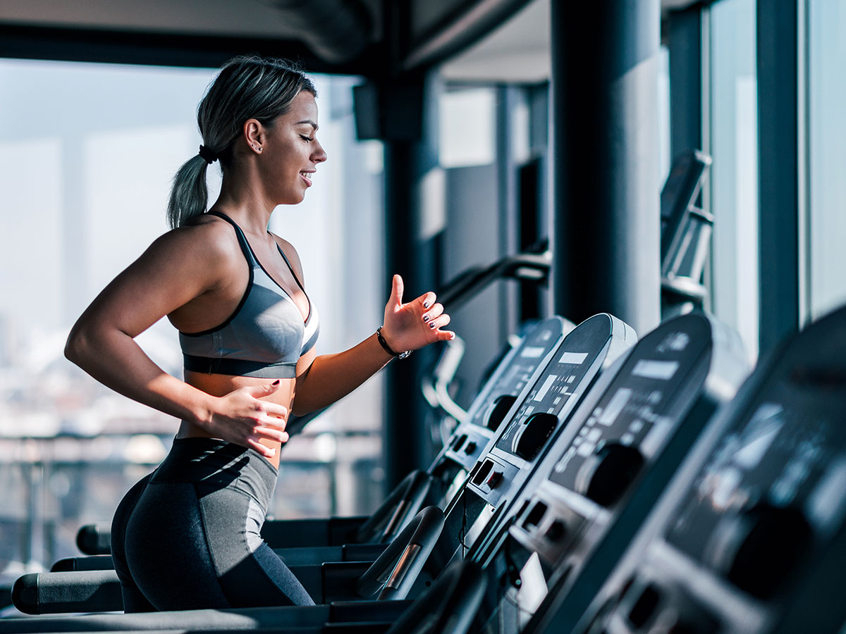 Image of a woman running on a treadmil