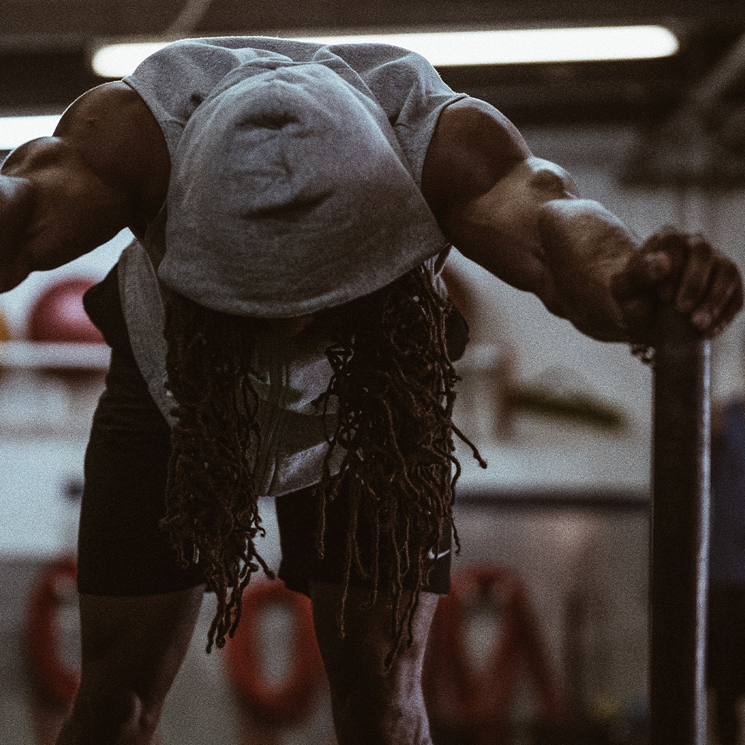 man pushing a weighted sled